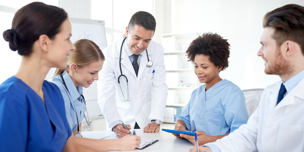 Group of physicians taking notes at the hospital